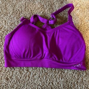 Pink sports bra with removable pads.